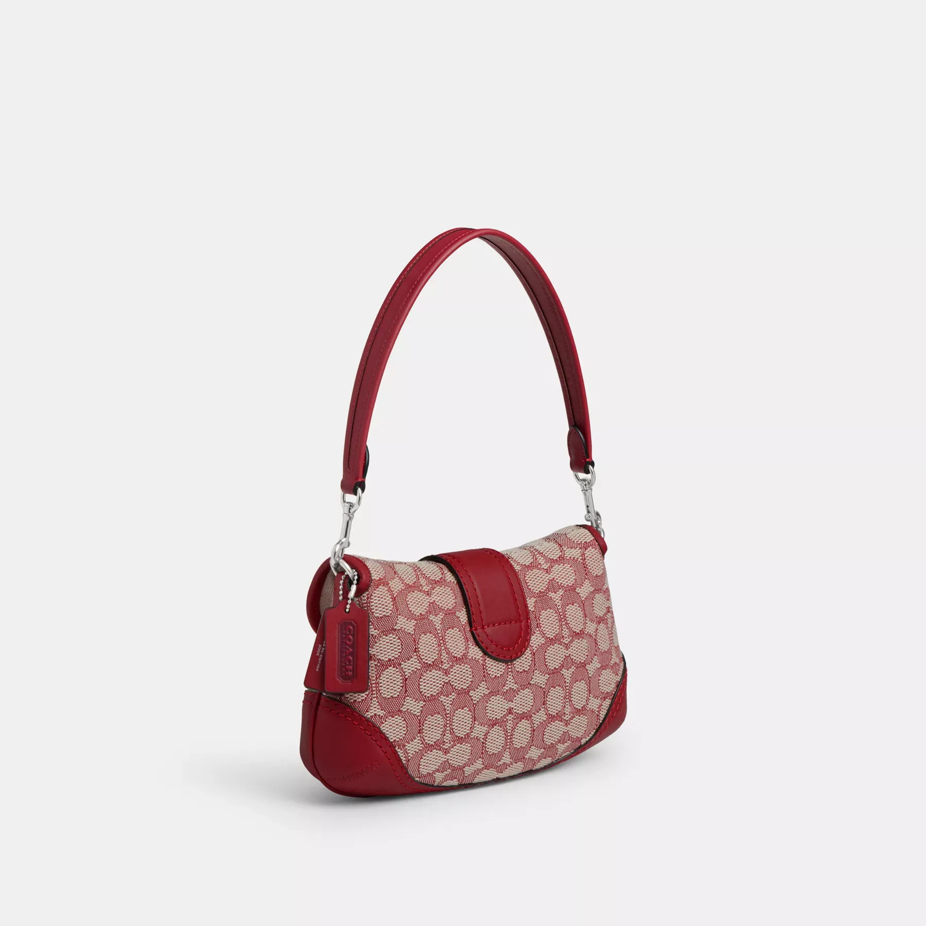 COACH Soho Flapväska i signaturtextil jacquard Ruby Ivory COACH Soho Flapväska i signaturtextil jacquard Ruby Ivory